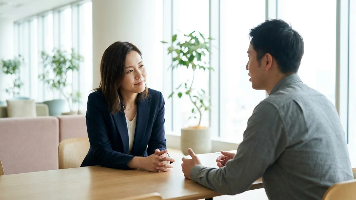 A manager and team member having an attentive, empathetic one-to-one conversation